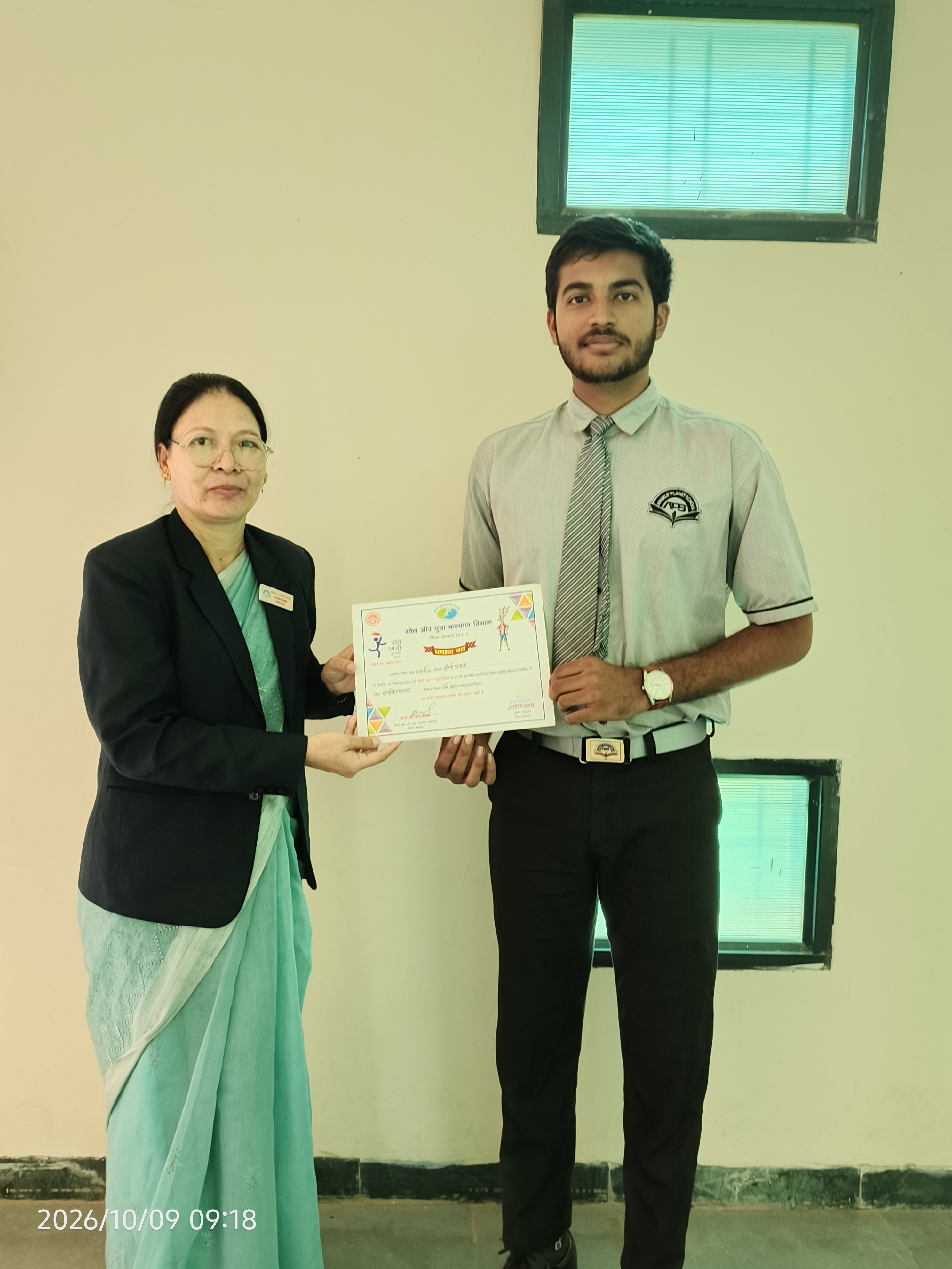 Student receiving a certificate of achievement